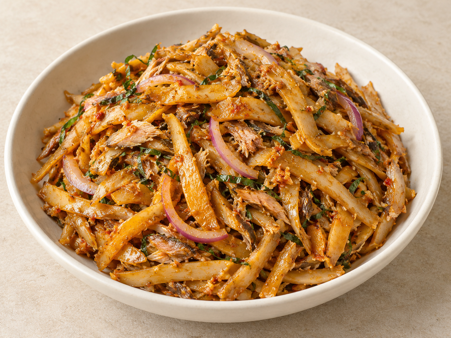 Ugba oil-bean salad with smoked-fish flakes, red onion and garden-egg leaf shreds