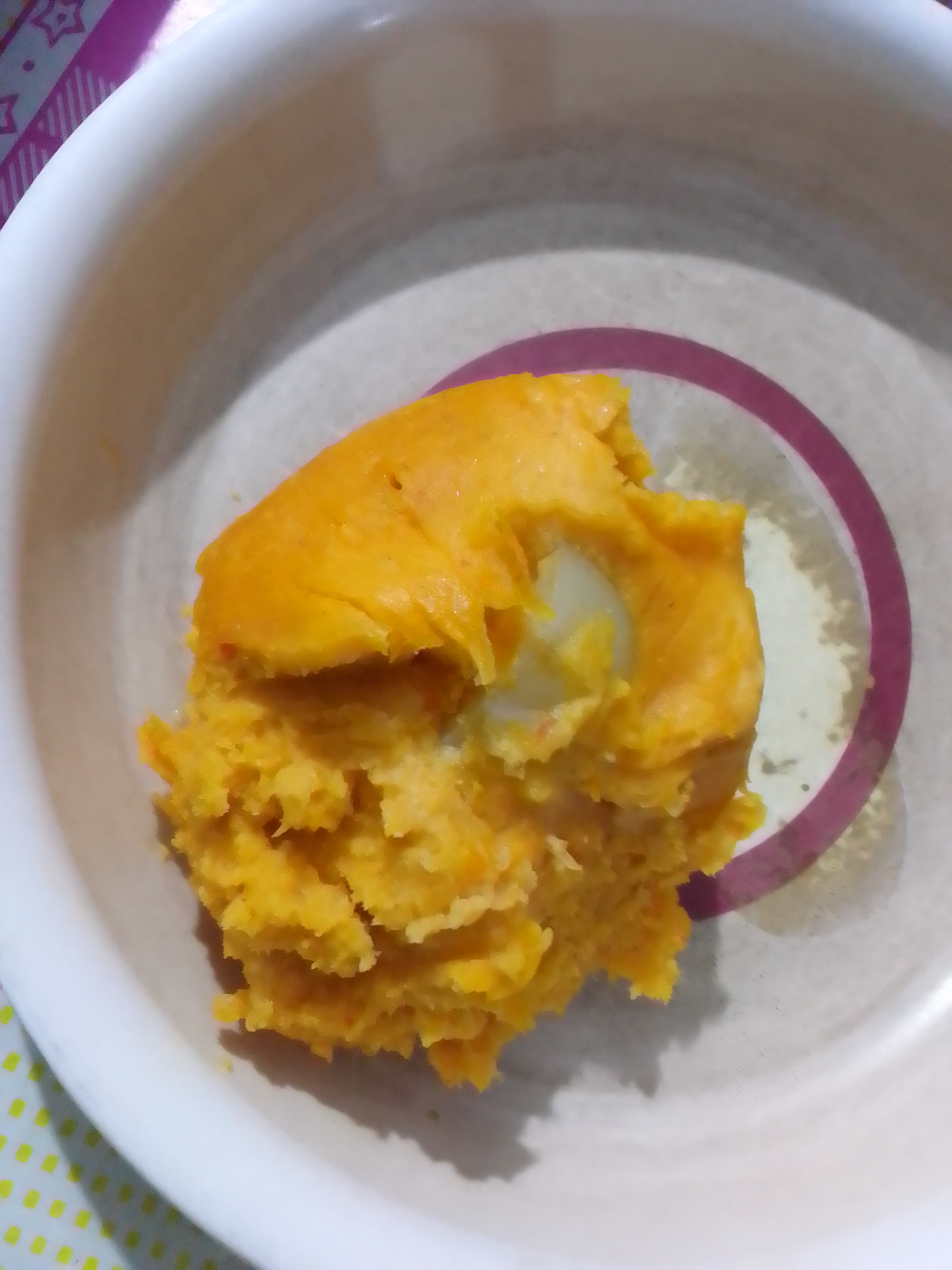 Abari corn pudding broken open in a bowl