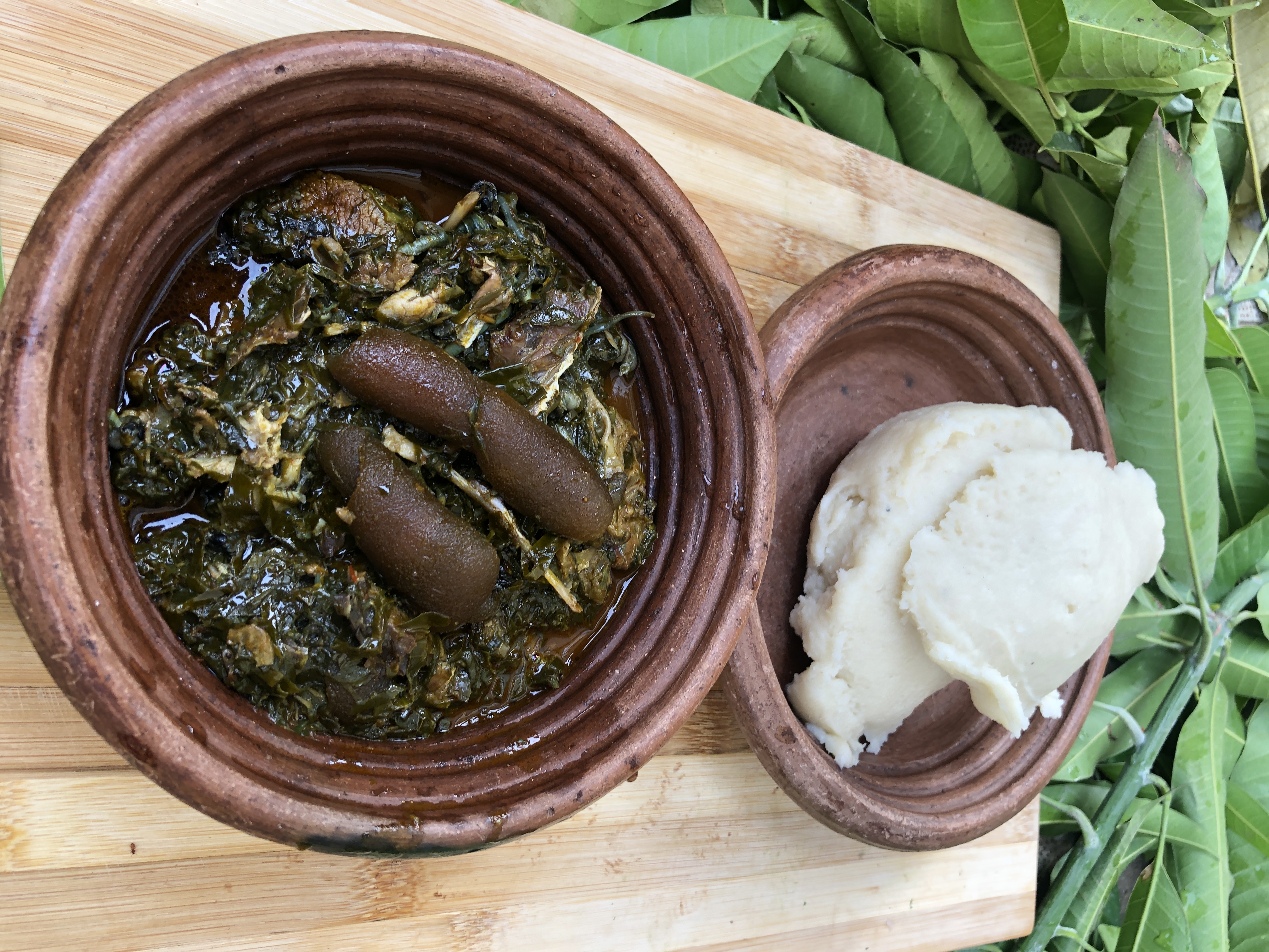 Afang leafy soup with meat and fish, served with pounded yam