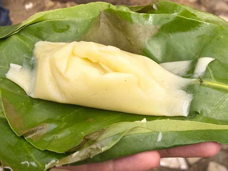 Agidi maize pudding on an opened leaf wrapper