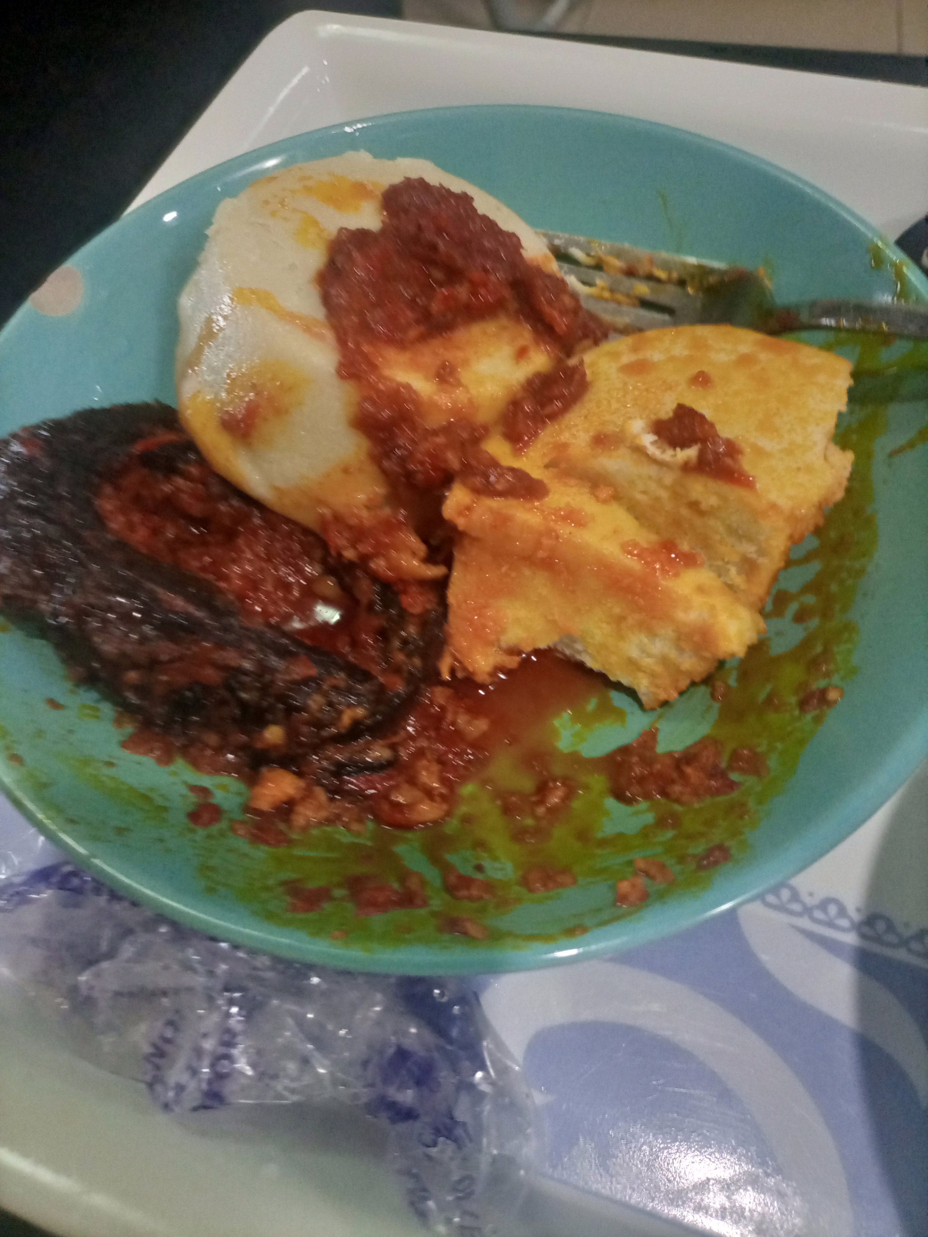 Ekuru bean pudding with fish sauce and a pale eko accompaniment
