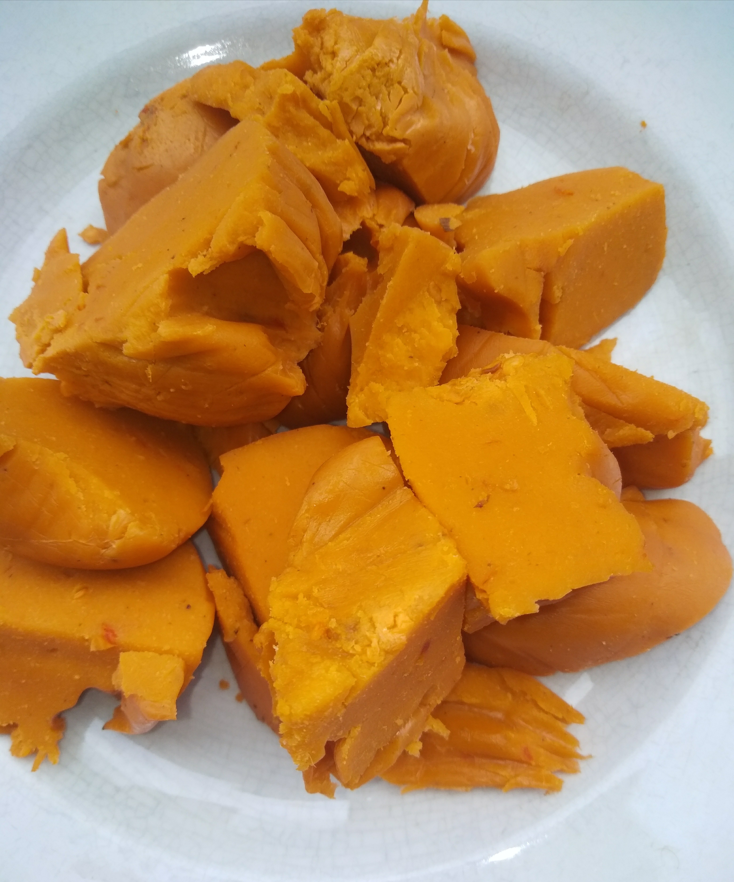 Golden okpa pudding cut into pieces