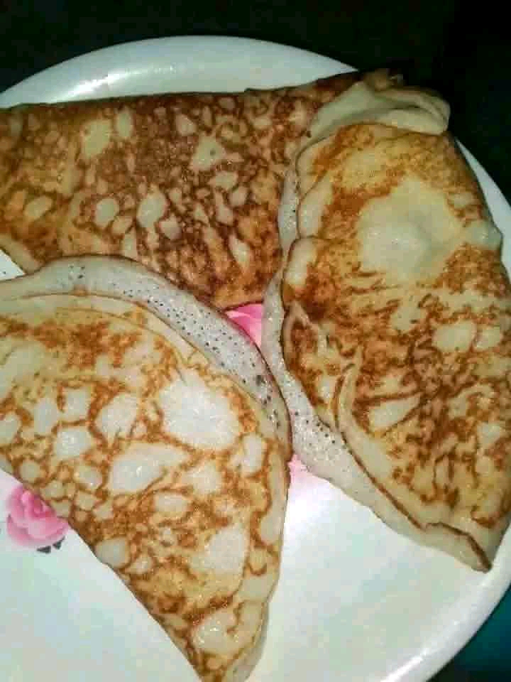 Folded sinasir rice pancakes with golden pan marks